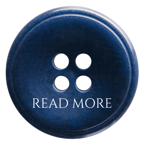 Close-up of a blue button with four holes and 'READ MORE' text.